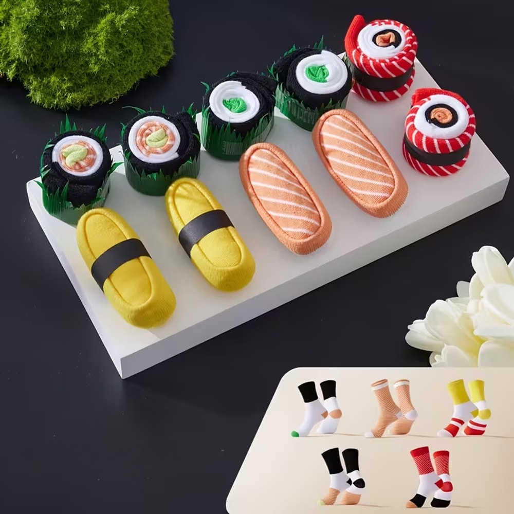 Pięć par skarpetek sushi ułożonych na desce do serwowania